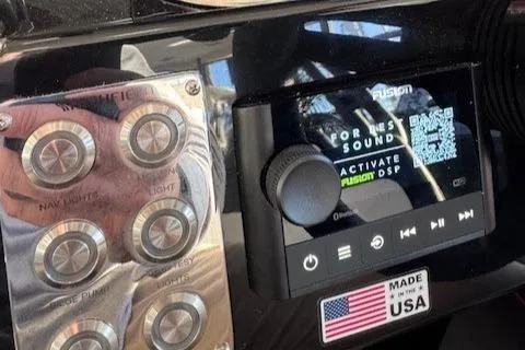 Slide: The Image of Control panel of 2025 Highfield Jet 420 with audio system and USA sticker. - 14