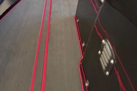 Slide: The Image of Highfield Jet 420 boat interior with sleek black and red design, 2025 model. - 15