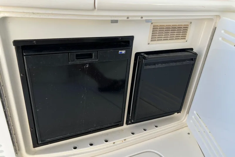 Slide: The Image of Built-in refrigerator and storage on a 1998 Sea Ray 540 Sundancer yacht. - 12