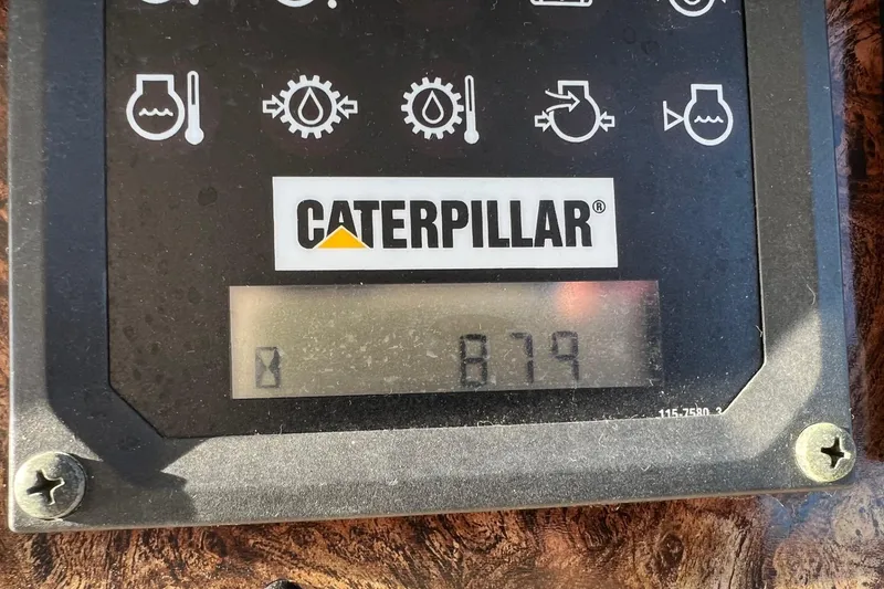 Slide: The Image of Caterpillar engine hour meter displaying 879 hours on a 1998 Sea Ray 540 Sundancer. - 30