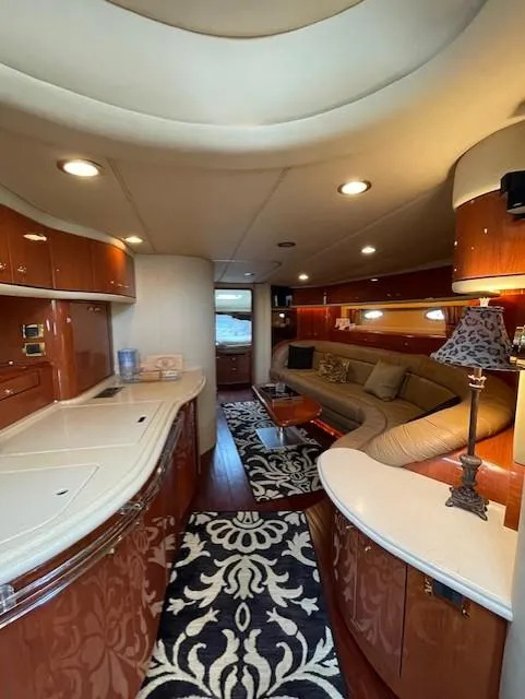 Slide: The Image of Luxurious interior of a 1998 Sea Ray 540 Sundancer yacht with elegant wood finishes. - 33