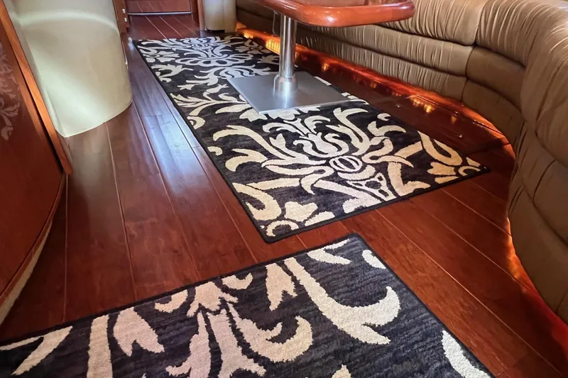 Slide: The Image of Luxurious interior of 1998 Sea Ray 540 Sundancer with elegant wood flooring and patterned rugs. - 35