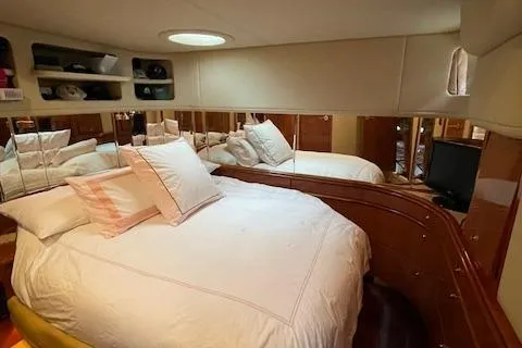 Slide: The Image of Luxurious bedroom interior of 1998 Sea Ray 540 Sundancer yacht with cozy bedding. - 47
