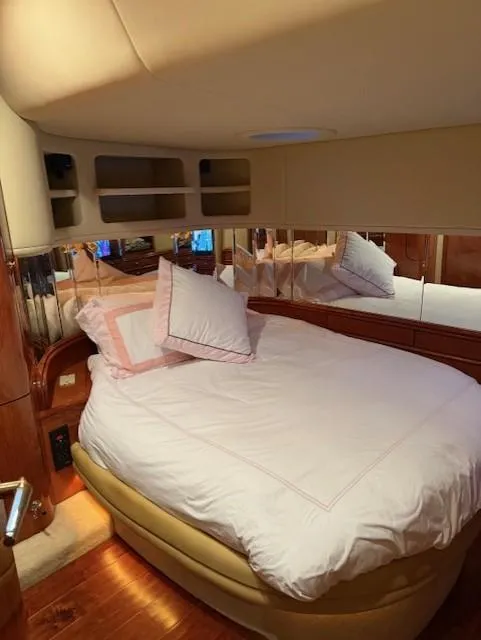 Slide: The Image of Luxurious bedroom interior of 1998 Sea Ray 540 Sundancer yacht with cozy bedding. - 48