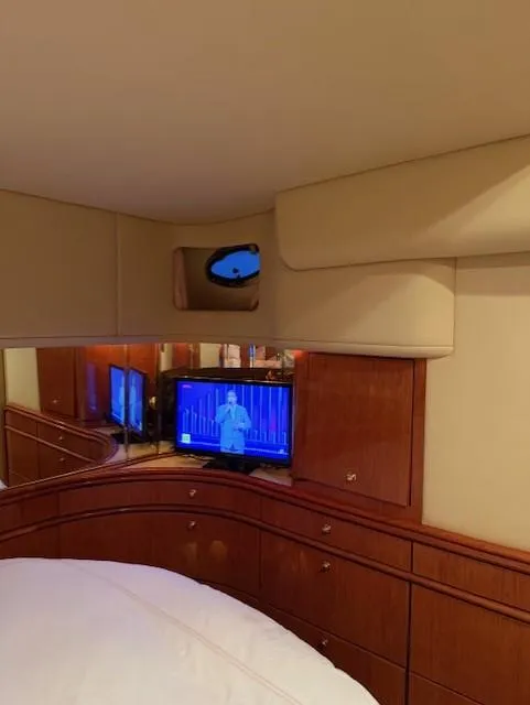 Slide: The Image of Interior of 1998 Sea Ray 540 Sundancer with TV and wooden cabinetry. - 50