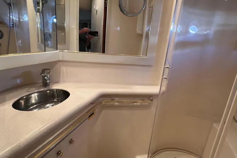 Slide: The Image of Bathroom interior of 1998 Sea Ray 540 Sundancer yacht with sink and mirror. - 53