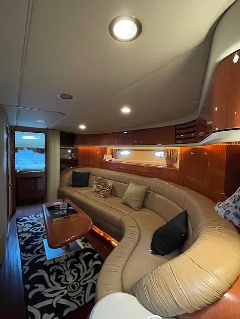 Slide: The Image of Luxurious interior of a 1998 Sea Ray 540 Sundancer yacht with plush seating and elegant decor. - 57