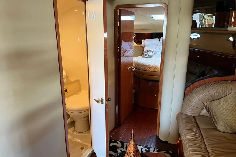 Slide: The Image of Interior of 1998 Sea Ray 540 Sundancer yacht, featuring a cozy cabin and bathroom. - 61