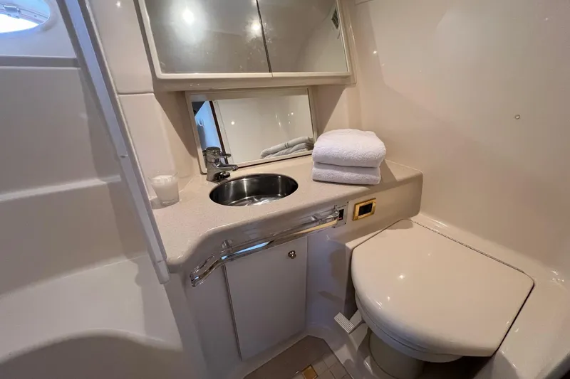 Slide: The Image of Luxurious bathroom in 1998 Sea Ray 540 Sundancer yacht with sink and toilet. - 62