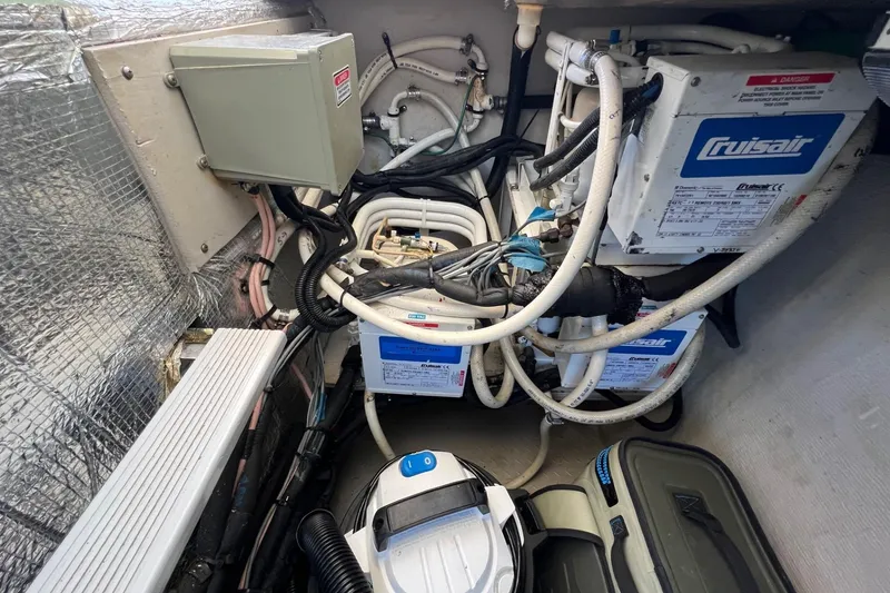 Slide: The Image of Engine room of 1998 Sea Ray 540 Sundancer with Cruisair systems and wiring. - 71