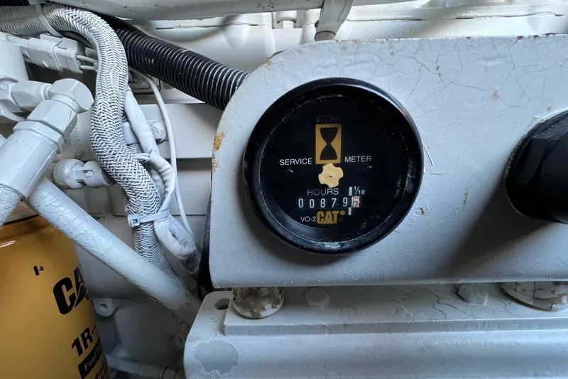 Slide: The Image of Engine service meter on 1998 Sea Ray 540 Sundancer, showing 879 hours. - 74