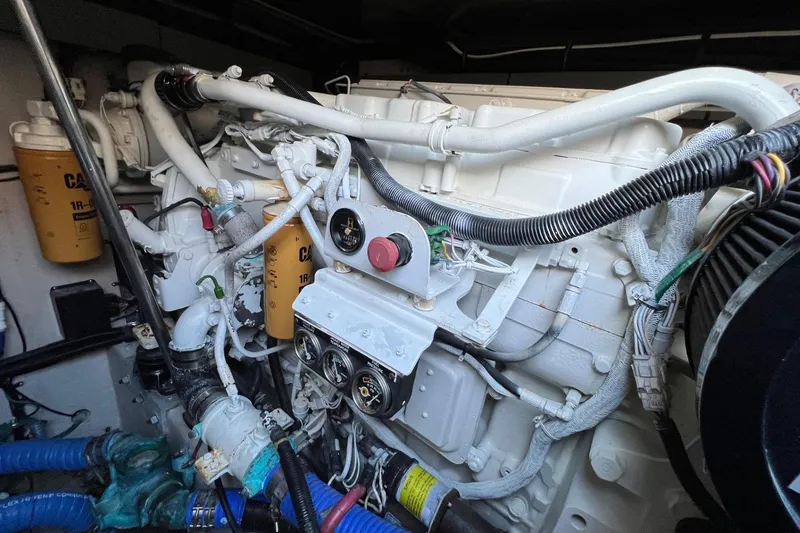 Slide: The Image of Engine compartment of a 1998 Sea Ray 540 Sundancer with visible components and wiring. - 75