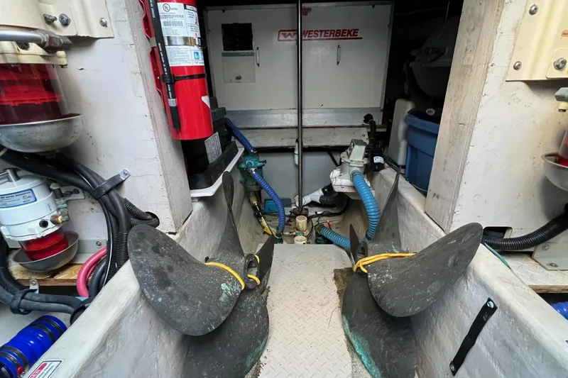 Slide: The Image of Engine room of 1998 Sea Ray 540 Sundancer with propellers and equipment. - 80