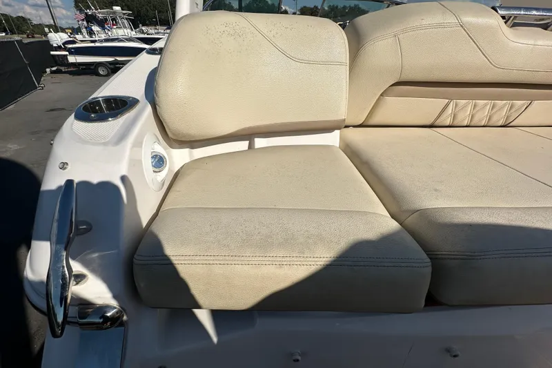 Slide: The Image of 2019 Regal 26 OBX boat with beige leather seating and cup holder. - 15