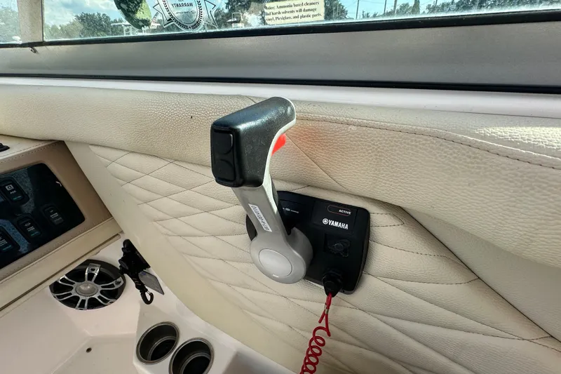 Slide: The Image of 2019 Regal 26 OBX boat interior with Yamaha throttle control and quilted leather panel. - 39