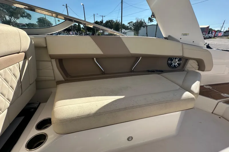 Slide: The Image of 2019 Regal 26 OBX boat interior with beige seating and cup holders. - 43