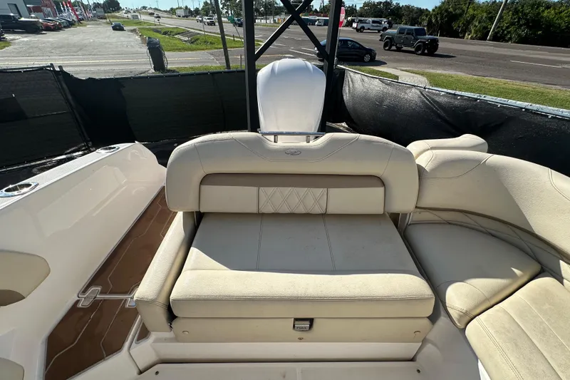 Slide: The Image of 2019 Regal 26 OBX boat interior with beige seating and deck view. - 46