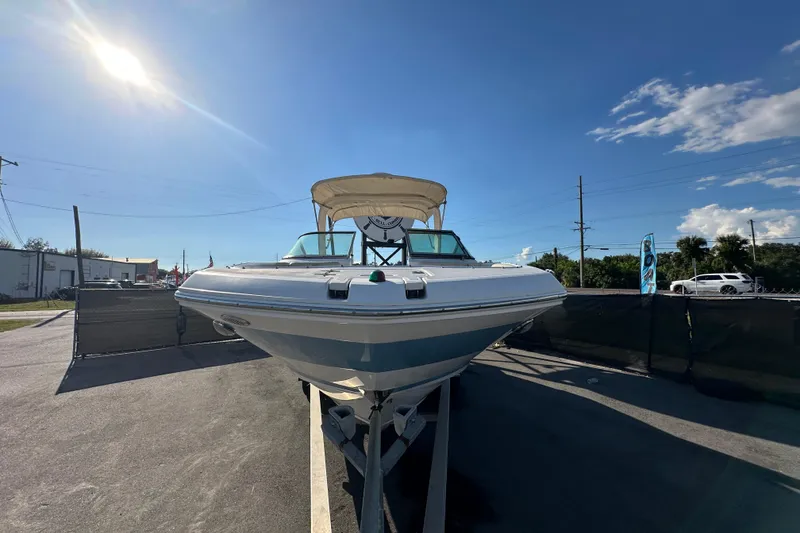 Slide: The Image of 2019 Regal 26 OBX boat on display under clear blue sky. - 6