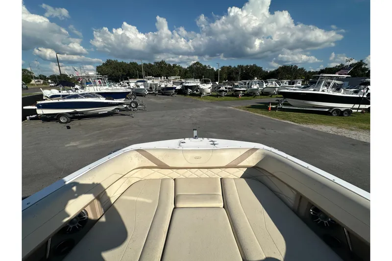 Slide: The Image of 2019 Regal 26 OBX boat interior with view of marina and other boats. - 66