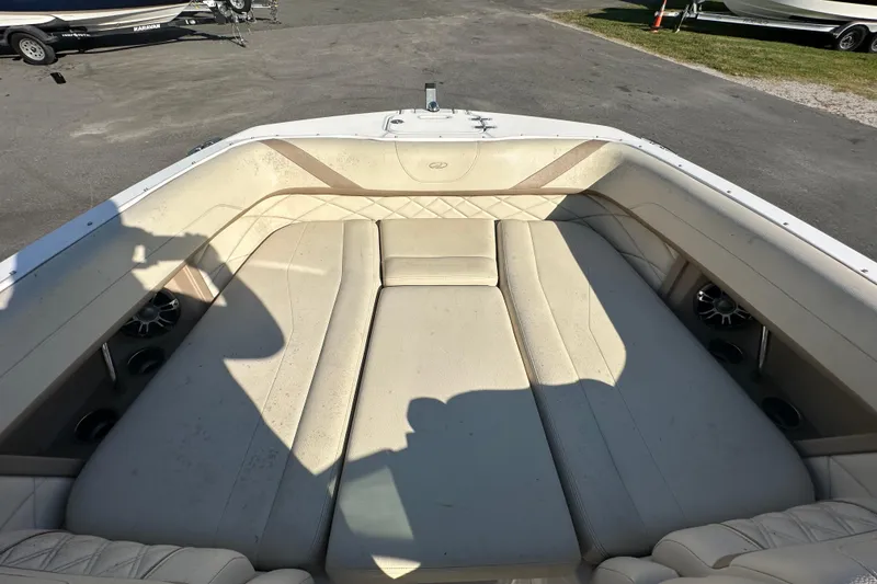 Slide: The Image of 2019 Regal 26 OBX boat interior with beige seating and speaker system. - 67