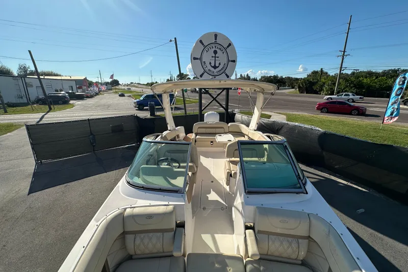 Slide: The Image of 2019 Regal 26 OBX boat displayed outdoors on a sunny day. - 76