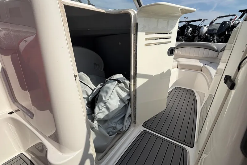 Slide: The Image of 2008 Yamaha Boats SX230 engine compartment with dual engines and ventilation hoses. - 10