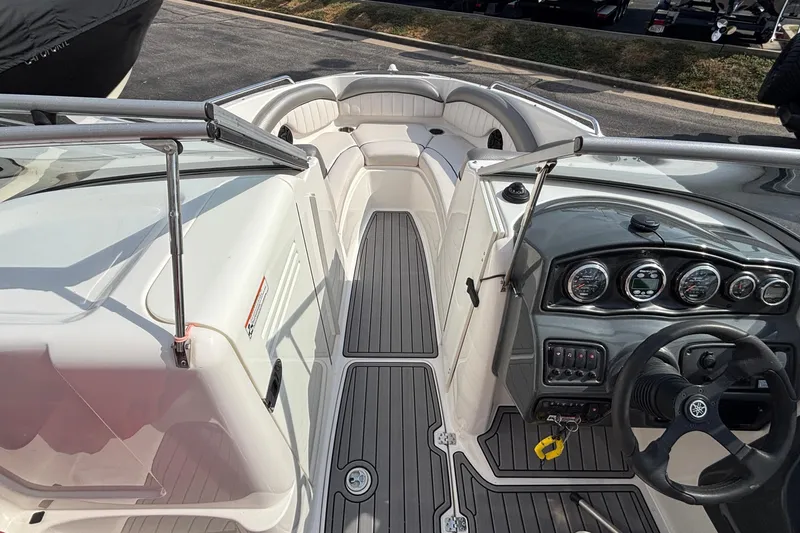 Slide: The Image of 2008 Yamaha SX230 boat interior with open engine compartment and red canopy. - 12