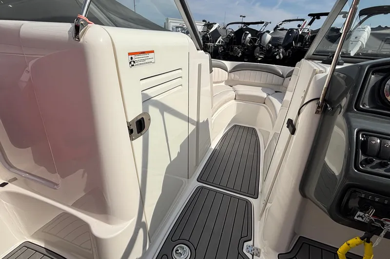 Slide: The Image of 2008 Yamaha Boats SX230 battery compartment with wiring and components. - 13