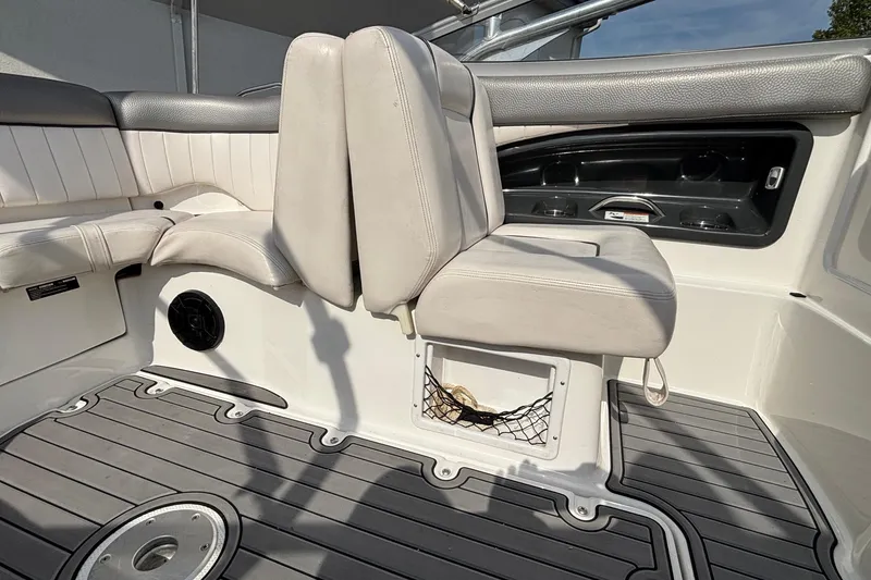 Slide: The Image of 2008 Yamaha Boats SX230 interior with white seating and gray flooring. - 17