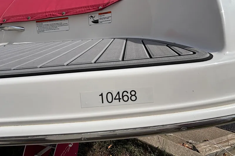 Slide: The Image of 2008 Yamaha SX230 boat interior with gray seating and storage compartments. - 21