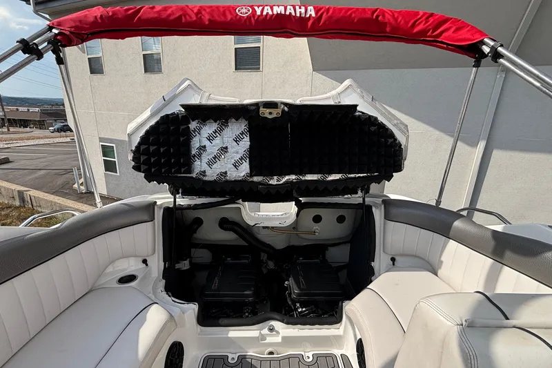 Slide: The Image of 2008 Yamaha Boats SX230 interior with white seating and gray flooring. - 24