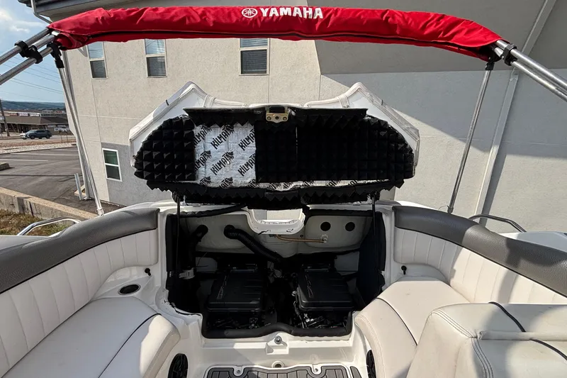 Slide: The Image of 2008 Yamaha Boats SX230 interior with gray and white seating, featuring built-in speakers. - 25