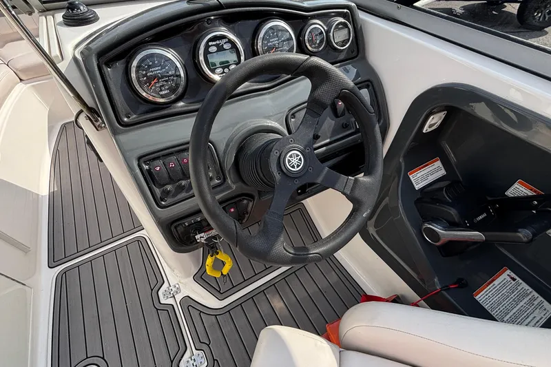 Slide: The Image of 2008 Yamaha Boats SX230 interior with steering wheel and seating area. - 28
