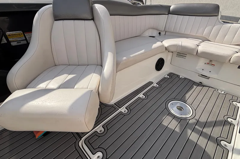 Slide: The Image of 2008 Yamaha SX230 boat interior with open storage compartment and seating area. - 30