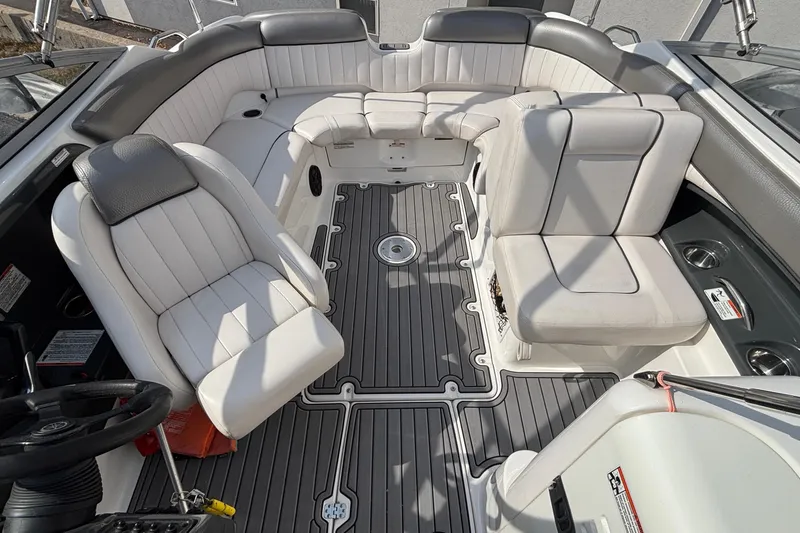 Slide: The Image of 2008 Yamaha Boats SX230 with red canopy, docked outdoors under blue sky. - 37