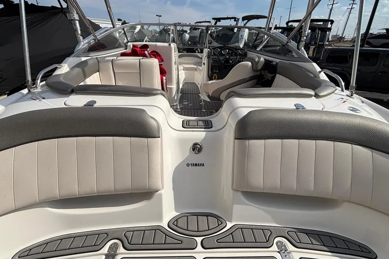 Slide: The Image of 2008 Yamaha Boats SX230 on trailer, red and white design, parked outdoors. - 4