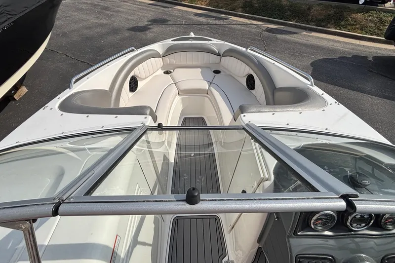 Slide: The Image of 2008 Yamaha Boats SX230 interior with open storage compartment and seating. - 6