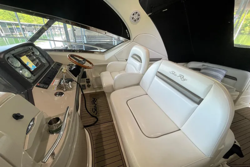 Slide: The Image of Interior of 2007 Sea Ray 38 Sundancer yacht with luxurious seating and navigation controls. - 10