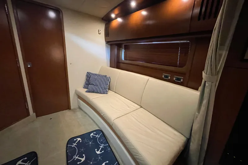 Slide: The Image of Luxurious interior of 2007 Sea Ray 38 Sundancer yacht with elegant seating and nautical decor. - 18