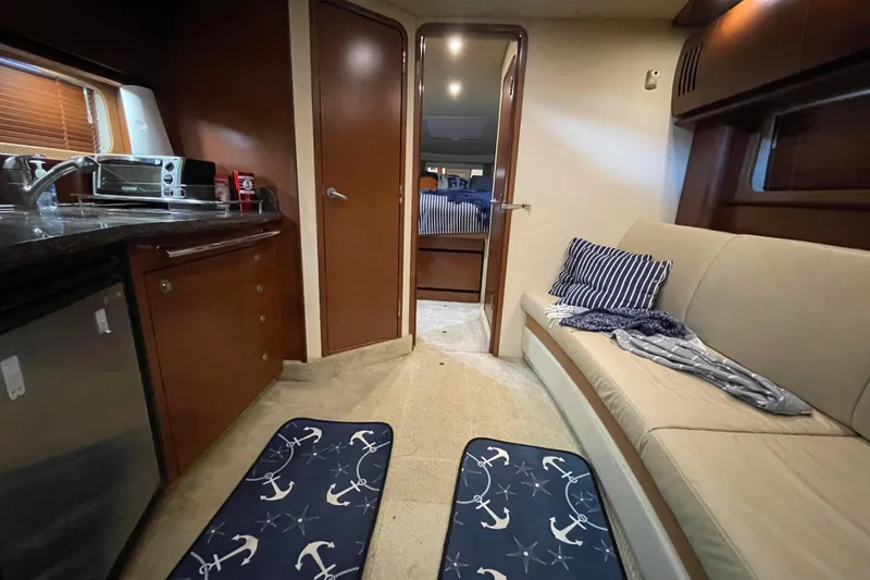 Slide: The Image of Interior of 2007 Sea Ray 38 Sundancer yacht with kitchen and seating area. - 23