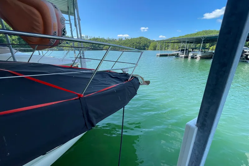 Slide: The Image of 2007 Sea Ray 38 Sundancer docked on a sunny day at a marina. - 28