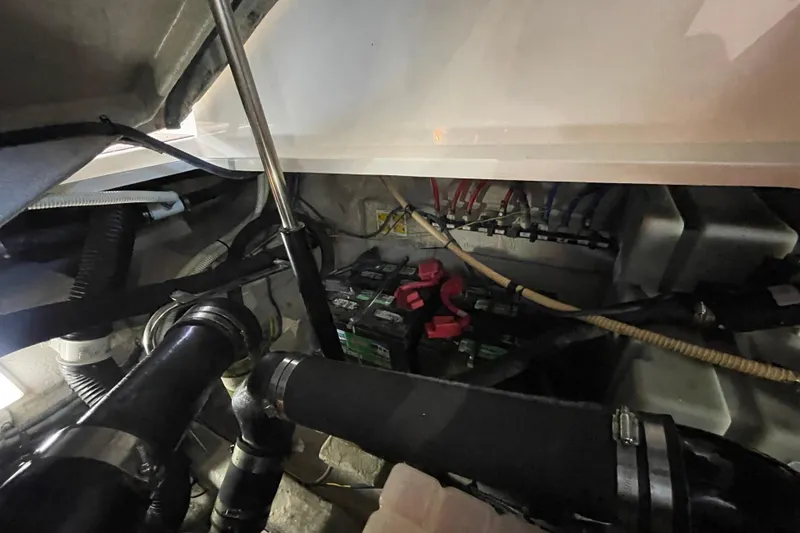 Slide: The Image of Engine compartment of a 2007 Sea Ray 38 Sundancer with visible wiring and components. - 31