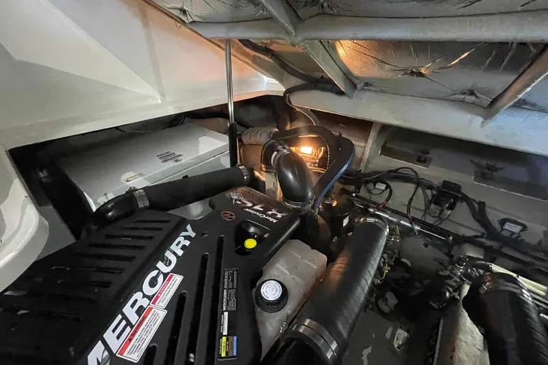 Slide: The Image of Engine room of 2007 Sea Ray 38 Sundancer with Mercury engine components. - 32