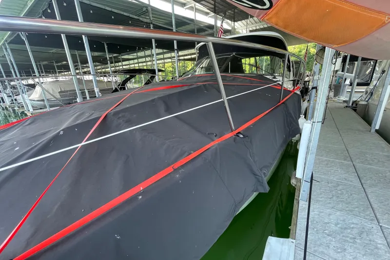 Slide: The Image of 2007 Sea Ray 38 Sundancer covered at marina dock. - 6