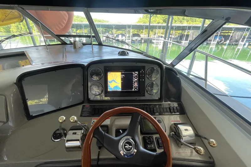 Slide: The Image of Helm of 2007 Sea Ray 38 Sundancer with navigation display and controls. - 7