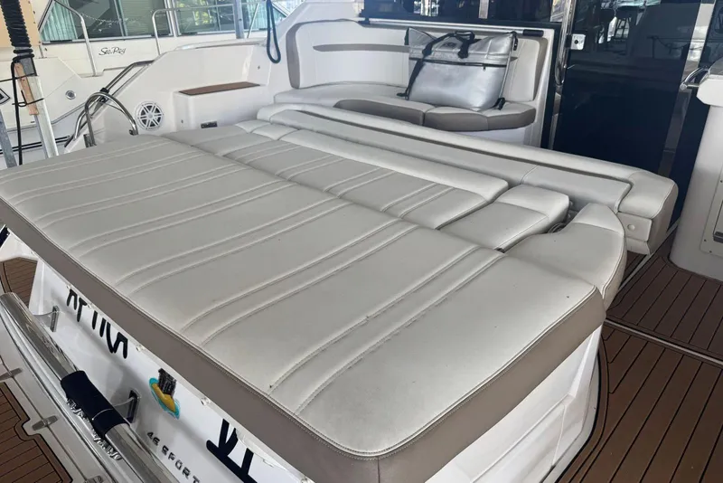 Slide: The Image of 2016 Regal 46 Sport Coupe yacht with spacious white leather seating area. - 10