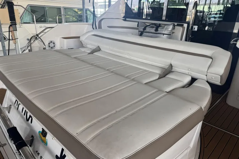 Slide: The Image of 2016 Regal 46 Sport Coupe yacht with spacious white leather seating area. - 11