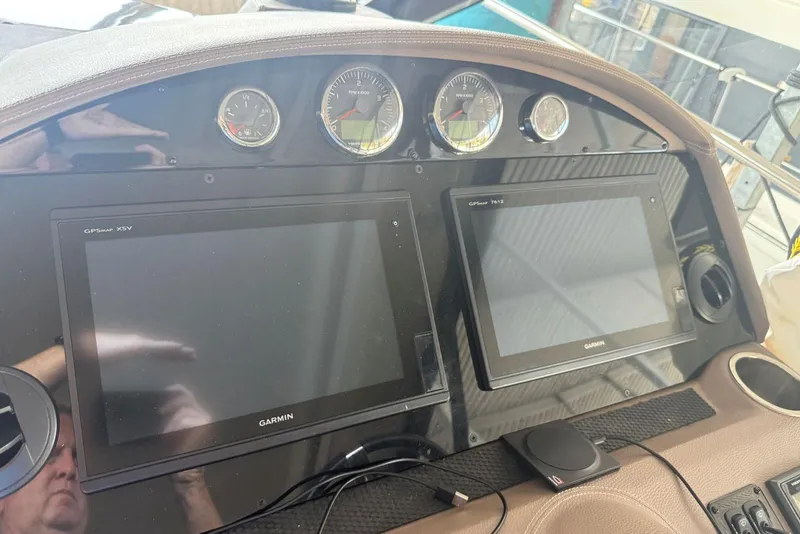 Slide: The Image of Dashboard of 2016 Regal 46 Sport Coupe with Garmin GPS displays and gauges. - 26