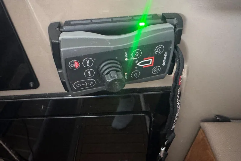 Slide: The Image of Control panel of a 2016 Regal 46 Sport Coupe with green indicator light. - 28