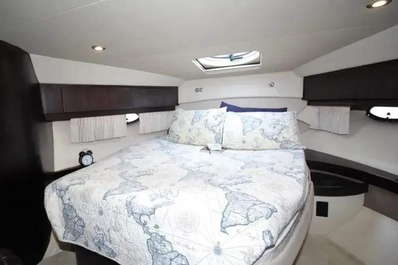 Slide: The Image of Luxurious bedroom interior of 2016 Regal 46 Sport Coupe yacht with map-themed bedding. - 35